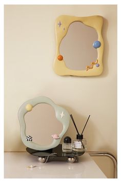 a mirror sitting on top of a counter next to a hair dryer