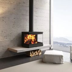 a modern fireplace in the middle of a living room