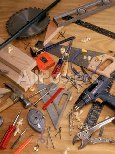 many different tools are laying out on the floor