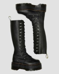 Only for the brave. Our new 1B60 boots hit max volume. Then go even louder. Set on our highest ever platform sole, the knee-high boots have a towering 20-eye silhouette enhanced with a statement dual lacing system – a combination of eyelets and logo rivet D-rings. Crafted from soft Pisa leather, the platform boots are finished with an inside zip for easier access. They come marked with yellow welt stitching and a scripted AirWair heel loop. Pisa is a medium-weight milled nappa leather with a sof Womens Platform Boots, Laced Boots, Dr Martens High Boots, Black High-top Laced Platform Boots, Thigh Boots, Black Edgy Lace-up Platform Boots, Fitted Lace-up Punk Platform Boots, Gothic Leather Lace-up Platform Boots, Gothic Lace-up Boots With Platform