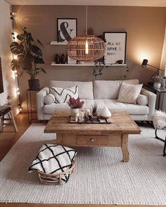 a living room filled with furniture and decor on top of a hard wood floored floor