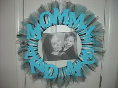 a mom and me wreath hanging on the front door