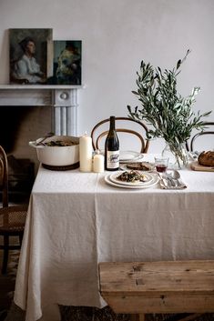 the table is set with food and wine