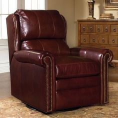 a brown leather recliner in a living room