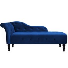 a blue couch sitting on top of a white floor