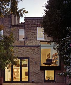 a brick building with lots of windows and stairs