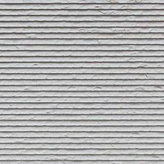 the texture of an old white wall with vertical lines and horizontal stripes is seen in this image