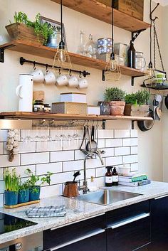 the kitchen is clean and ready to be used as a place for potted plants