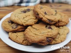 a white plate topped with chocolate chip cookies