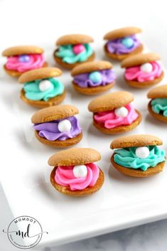 there are many cookies that have frosting on them and sprinkles in the shape of sandwiches