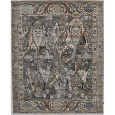 an area rug with various colors and patterns on it, including blue, beige, gray and