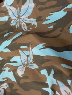 "This blue tropical floral print and brown camouflage fabric can be used in quilting, scrapbooking, junk journaling, or any other craft projects needing fabric. This fabric has a smoother, thicker, stiffer feel to it. Material is unknown as I initially bought second hand a few years ago. I assume it is either an upholstery type fabric with waterproofing on it. For this reason I am selling as is. No stains, no tears, no odors, no fraying on edges, solid piece that measures 44\"x36 1/2\". The fabric has been folded since first recieving. This means the fabric has fold lines and/or wrinkles on it that can be removed by ironing." Hawaiian Shirt Fabric, Hawaiian Fabric Prints, Tropical Textile Prints, Tropical Leaf Print Fabric, Hawaiian Floral Print, Floral Camo, Hawaiian Theme, Tropical Floral Print, Tropical Floral