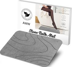 the stone bath mat is shown in front of a white box with an image of a woman's legs on it