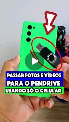 a person holding up a cell phone with the text passar fotos videos para o pendriver