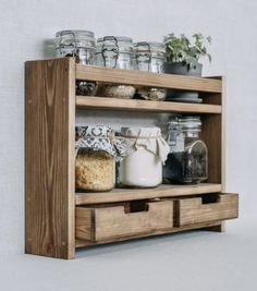 a wooden shelf with jars and containers on it