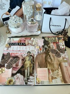 the contents of a chanel book are displayed on a table with bags and purses