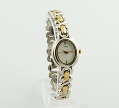 This elegant women's Lorus watch features a sophisticated blend of silver and gold tones. It boasts a wide, flat oval case and a durable, water-resistant design. The metal bracelet incorporates larger silver links intermixed with smaller golden ones, creating a striking contrast. Dimensions: Bracelet Length: up to 18 cm (7.1 inches) - adjustable Case Width: 2.2 cm (0.9 inches) Bracelet Width: 1 cm (0.4 inches) Condition: The watch shows signs of wear, including scratches on the bracelet, minor chips around the edge of the dial, and some corrosion on the inner side of the bracelet. More details can be seen in the photos. All presented watches are tested and in working condition, also equipped with new batteries. I can reduce the length of the strap at the buyer's request within the limits t Two Toned Womens Watches, Two Tone Watches Women, Two Toned Watch, Victorian Yellow Gold Self-winding Watch, Antique Self-winding Yellow Gold Watch, Water Resistant Watch, Classic Self-winding Collectible Watch, Vintage Watches Women, Watch Gift