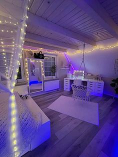 the room is decorated in white and purple lights