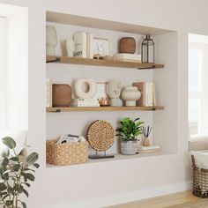 a living room filled with lots of furniture next to a wall mounted shelf above a window