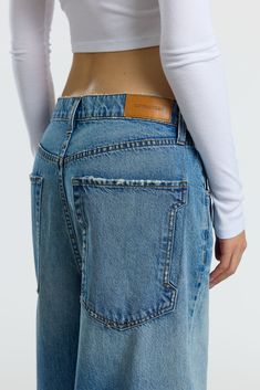 Baggy Washed Jeans In Recycled Denim, Oversized Faded Cotton Jeans, Baggy Indigo Denim Jeans, Baggy Faded Rigid Denim Bottoms, Baggy Washed Blue Cotton Jeans, Back Pocket Design, Apple Leather, Baggy Jean, Menswear Details