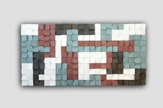 a piece of art made out of different colored blocks