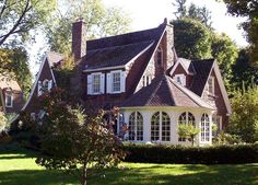 a large house with many windows in the front yard