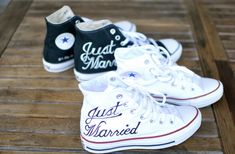 three pairs of white and black converse shoes with just married written on the soles