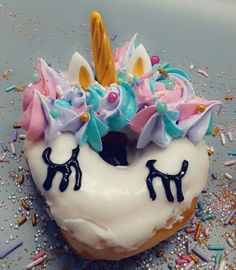 a doughnut with unicorn decorations on top of it