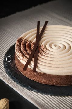 a chocolate cake with white frosting on top