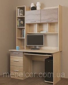 a computer desk with a monitor and keyboard