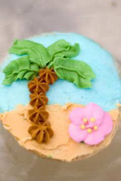 a decorated cupcake sitting on top of a table