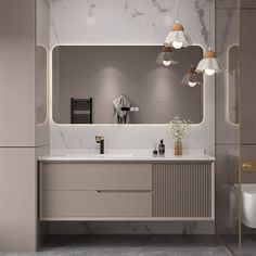 a bathroom with marble counter tops and lights