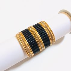 22pieces Metal Black & Gold Bangles Set Indian Pakistani Bracelets, Contains 4 Large Bangles With Studded Cubic Zirconia, Which Can Also Be Worn Separately. Size Small, 2.4 Which Fits Small Wrist, If You Wear Size 4 To 6 In Dress And Has Small Wrist, This Is Perfect Size. Great For Wedding, Events, Social Gathering Or Festivals. More Colors Available, Check Out Other Listings. Bundle To Get Huge Discount. Free Gift Shipping In 24 Hours Traditional Black Bracelets For Party, Traditional Black Party Bracelets, Traditional Black Bracelets For Weddings, Traditional Black Bracelet For Wedding, Traditional Black Wedding Bracelets, Black Bangle Bracelets For Festive Occasions, Traditional Black Beaded Bracelets For Festive Occasion, Traditional Black Bangle Gift, Festive Black Bangle Bracelets