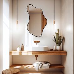 a bathroom with a sink, mirror and wooden shelf in front of the counter top