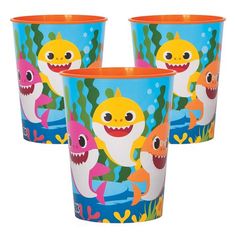 three plastic cups with sharks on them