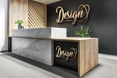 an office reception area with marble counter tops and gold lettering that reads respect on the wall