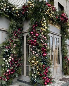 christmas decorations on the outside of a building