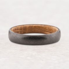 a wedding band made from wood and metal