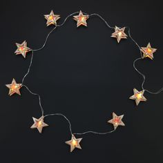 a string of star lights on a black background