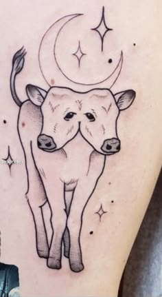 a couple of cows standing next to each other on the back of a woman's stomach