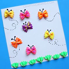 colorful paper butterflies on a white card