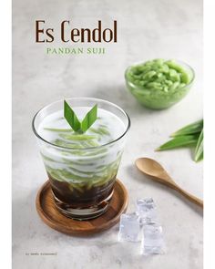 the cover of es cendol magazine features an image of a dessert and ice cubes