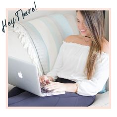 a woman sitting on a couch using a laptop computer with the words hey there above her