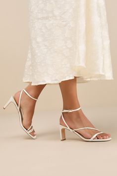 Keep things chic and simple by adding the Lulus Kierha White Satin Strappy Low Heel Sandals to any of your effortlessly elegant 'fits! Sleek woven satin shapes these darling heels that feature a square footbed and a trio of slender straps that cross the vamp. A matching strap wraps the front of the ankle and secures with a gold buckle, all atop a trendy blade heel. 2. 75" wrapped blade heel. Cushioned insole. Felted rubber sole has nonskid markings. Man made materials. Imported. Lulus | Kierha White Satin Strappy Low Heel Sandal Heels | Size 6.5. Low Heels Sandals, Strappy Wedding Heels, Elegant Fits, Bridesmaids Heels, White Strappy Heels, Prom 2024, Low Heel Sandals, Senior Prom, Size 11 Heels