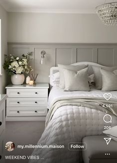 a white bed sitting in a bedroom next to a dresser with drawers and lamps on top of it