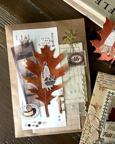 an assortment of paper and crafting items on a table