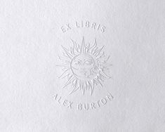 a white paper with the words ex libris alex burton written in white ink