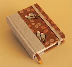 a small book with two birds on it