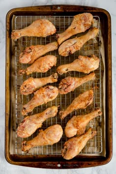 chicken on a baking sheet with the words crispy oven baked chicken written above it