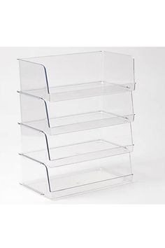 three clear acrylic trays stacked on top of each other in the same position